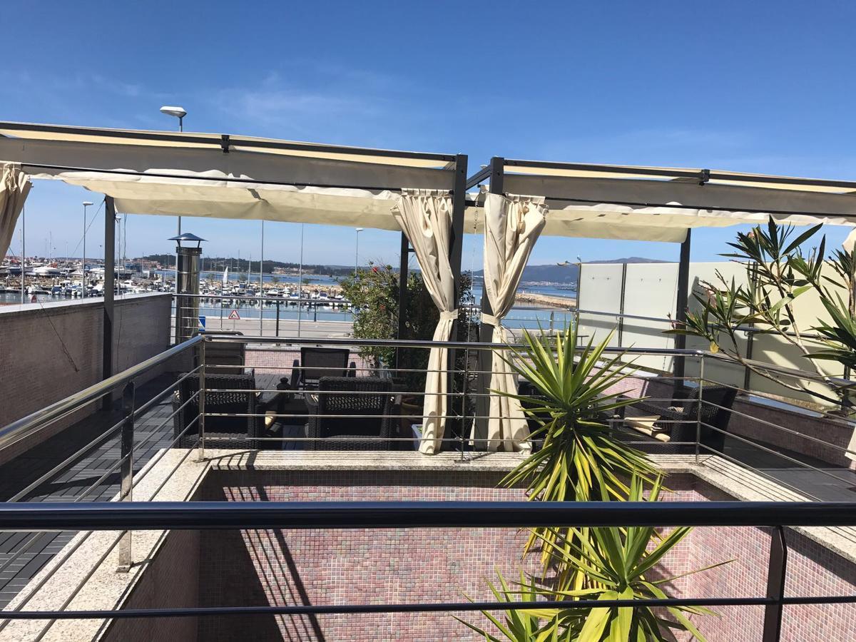 Apartamentos Puerto Basella Вилануева де Ароса Екстериор снимка